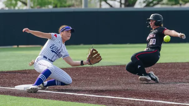 Emalee Romero slides to catch the softball and tag out a Texas Tech runner attempting to steal third base on March 31, 2026