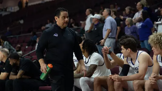 Athletic trainer Alfred Castillo walks down the bench at the 2026 WAC Basketball Tournament in Las Vegas on March 11, 2026