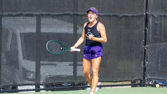 Elsa Luthar yells in celebration after winning a point against her opponent on April 1, 2026 against UT Arlington.