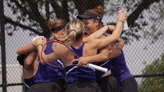 ACU women's tennis players celebrate a win in the WAC Tournament semifinal over Utah Tech on April 17, 2026