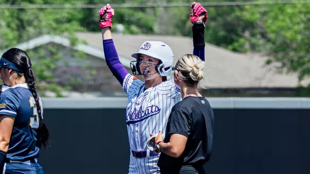 Audrey Lacina celebrates after reaching first base against California Baptist on April 25, 2026