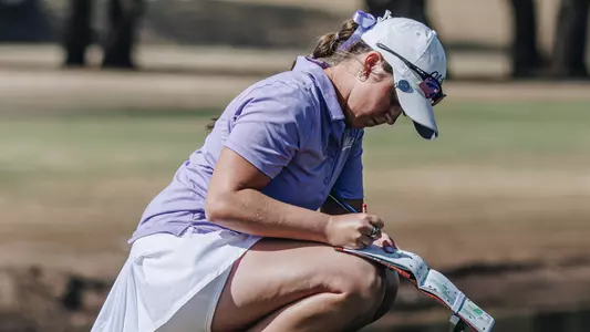 Ryann Honea writes in her scorebook at the West Texas Classic at Abilene Country Club on March 2-3, 2026.