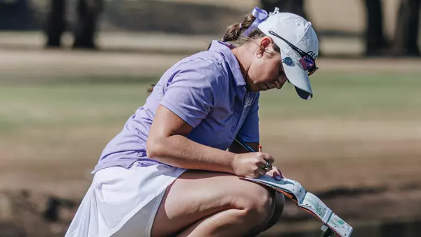 Ryann Honea writes in her scorebook at the West Texas Classic at Abilene Country Club on March 2-3, 2026.