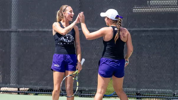 Alice Klinteby and Jess Board celebrate after winning a doubles point on April 1, 2026 against UT Arlington.