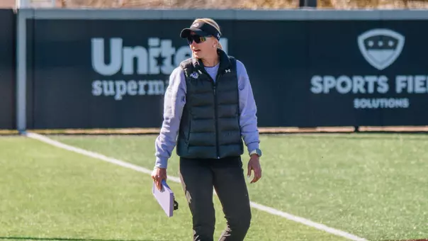Jo Koons talks to her dugout during a game against South Dakota State on February 11, 2026