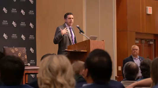 Zack Lassiter talks at ACU baseball's First Pitch Dinner in January 2026