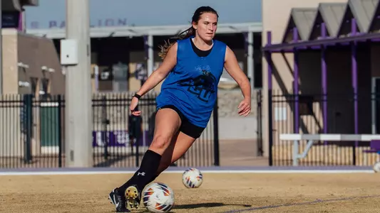 Gracie Kelly dribbles the ball during an ACU soccer practice at Elmer Gray Stadium on Feb. 12, 2026.