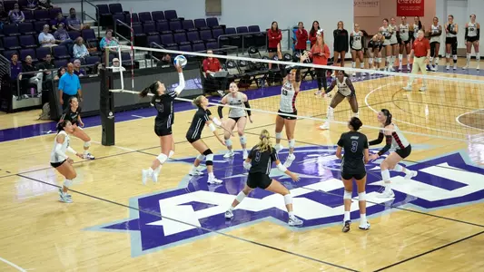 Maddie Finnegan sends a ball over the net in ACU's exhibition versus Texas Tech at Moody Coliseum on Aug. 14, 2026.