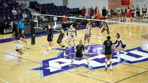 Maddie Finnegan sends a ball over the net in ACU's exhibition versus Texas Tech at Moody Coliseum on Aug. 14, 2026.