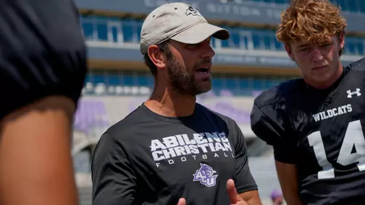 Graham Harrell talks to his quarterbacks after a scrimmage during fall camp on Aug. 15, 2026