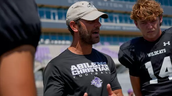 Graham Harrell talks to his quarterbacks after a scrimmage during fall camp on Aug. 15, 2026