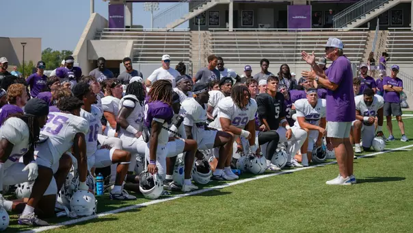 Head coach Keith Patterson talks to his football team after a practice on August 15, 2026