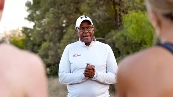 Coach Wayne Angel talks to his runners during the first cross country practice of the 2026 season