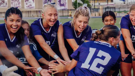 ACU soccer players give high-fives during starting lineup announcements against Houston on August 27, 2026