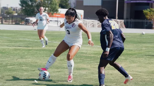 Mikayla Abrenica dribbling around an opponent against East Texas A&M on August. 30, 2026.