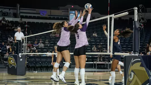 Hannah Gonzalez and Rachel Koss attempt to block an attack in ACU's 3-0 win over Oral Roberts in Tulsa, Okla. on Sept. 12, 2026.