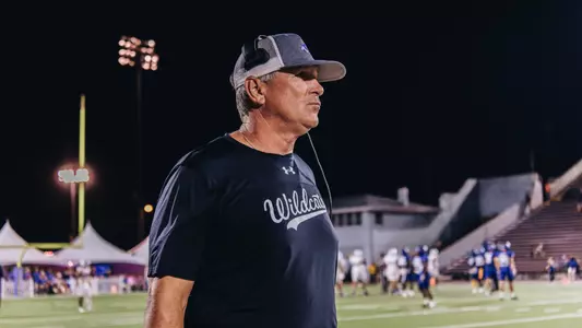 Head coach Keith Patterson looks out over the field at North Alabama during an October 2024 game