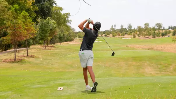 An ACU men's golfer takes a swing at Halbert National in Granbury, Texas.