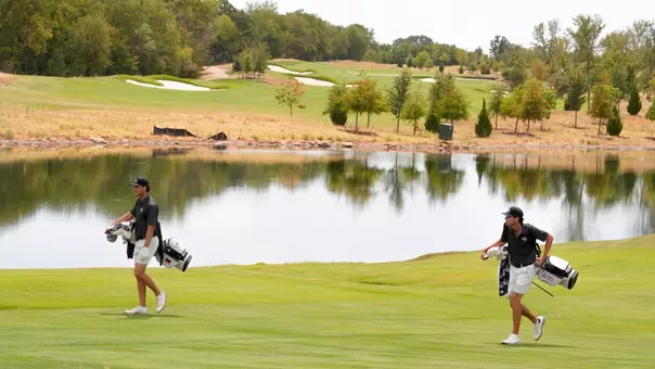 Luis Buech and Kade McDonough walk the course at Halbert National in Granbury, Texas.
