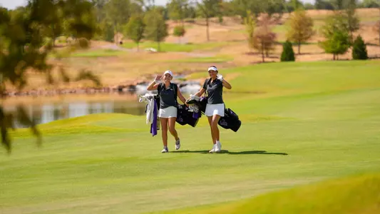 Alana Kutt and Julia Vollmer walk the course at Halbert National in Granbury, Texas.
