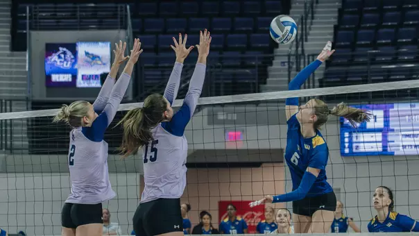 Avery Thaler and Hadlee Welch attempt to block an attack in ACU's matchup with Cal State Bakersfield at Moody Coliseum on Aug. 29, 2026.