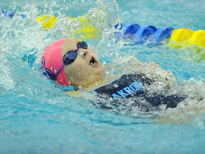 Zips Take Down Marshall in Swimming Action Image