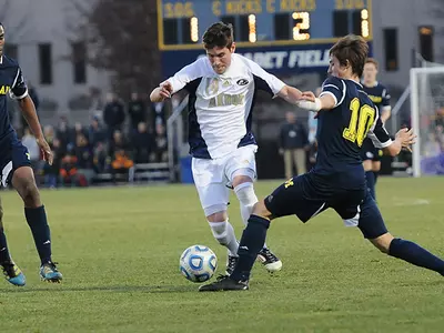 Men's Soccer Knocks Off Michigan 2-1, Dances Into Round of 16 Image
