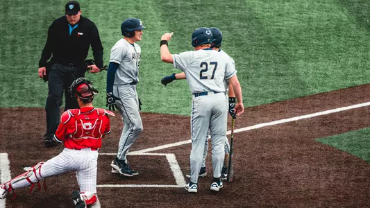Zips Celebrating a home run hit by Brady Bowen