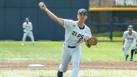 Action photo of Elijah Griffith pitching against NIU