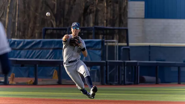 Tucker Biehl makes an athletic throw from the shortstop possition