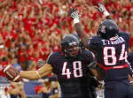 Wildcats Roll Over Huskies, 48-14