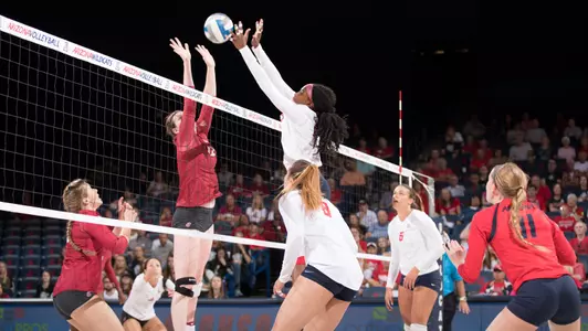 Freshman middle hitter Devyn Cross (13)