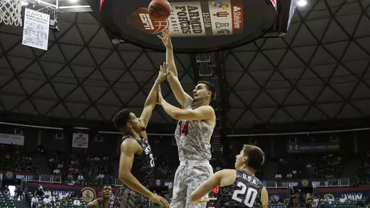 Dusan Ristic shoots a hook shot versus Michigan State