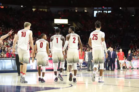 The team walk out on to the court after a timeout