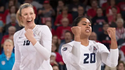Junior middle hitter McKenzie Jacobson (18) and senior setter Penina Snuka (20)