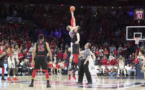 Lauri Markkanen wins the jump ball from Utah's David Collette