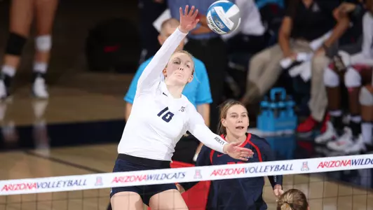 Freshman outside hitter Paige Whipple (10)