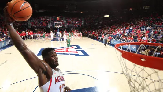 Deandre Ayton throws down a one-handed dunk during an exhibition.