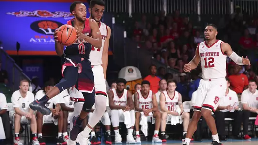 PJC looks to pass along the baseline versus NC State.
