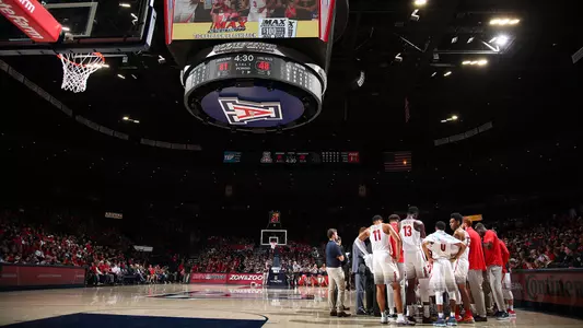 The Wildcat huddle during a timeout on the floor in McKale Center versus LBSU.
