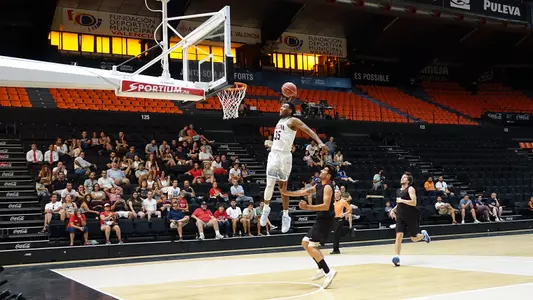 Allonzo Trier throws down a one-handed jam.