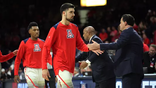 Dusan Ristic high fives Coach Sean Miller prior to the Utah game in McKale Center.