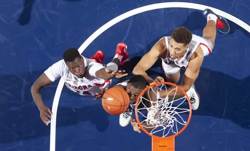 Sophomore guard Emmanuel Akot (24) and junior center Chase Jeter (4)