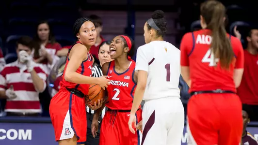 Freshman forward Sam Thomas, 14 and Sophomore guard Aari McDonald, 2