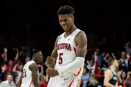 Brandon Randolph flexes after hitting a three-pointer versus Utah Valley.