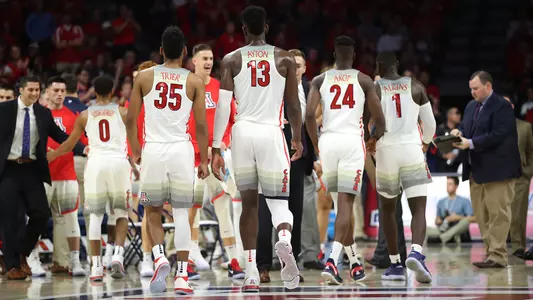 Arizona heads to its bench as a timeout is called