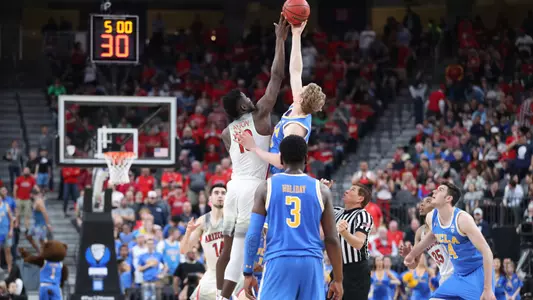 Deandre Ayton goes for a jump ball against UCLA in the semifinals of the 2018 Pac-12 Tournament.