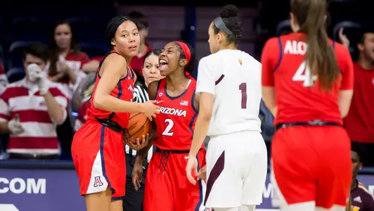 Freshman forward Sam Thomas, 14 and Sophomore guard Aari McDonald, 2