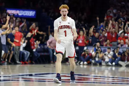 Arizona guard Nico Mannion reacts after making a defensive stop against Illinois during the first half of an NCAA college basketball game Sunday, Nov. 10, 2019, in Tucson, Ariz. (AP Photo/Rick Scuteri)