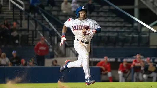 Donta Williams sprints down the first base line